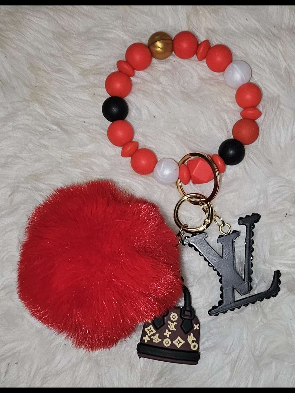LV Wristlette. Detachable Emblem, Purse, Pom Pom And Stretchable Wristlette - Picture 8 of 8